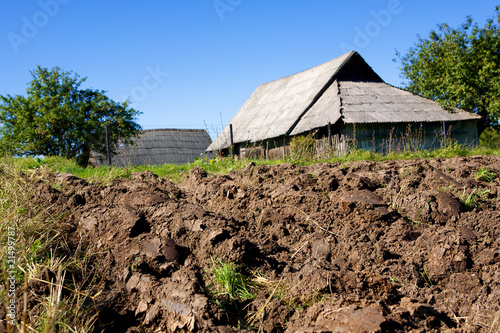 Fotografi arable land on village barn and sky background