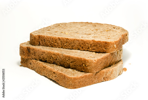 Three slices of brown bread isolated on white background