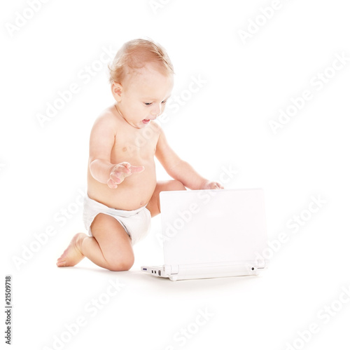 baby boy in diaper with laptop computer