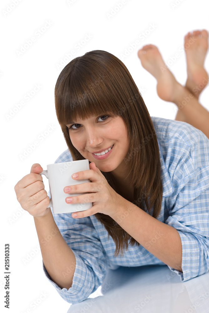 Smiling female teenager with cup of tea Smiling female teenager with cup of tea