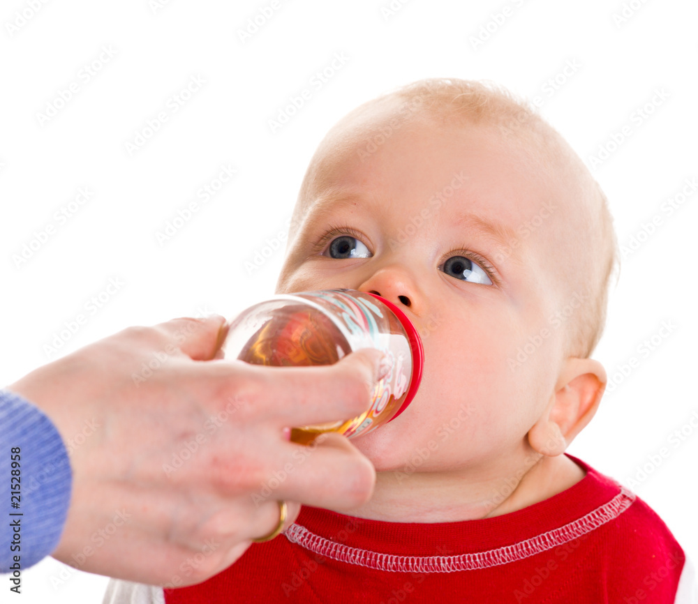 Mother feeding her newborn baby boy from bottle Mother feeding her newborn baby boy from bottle