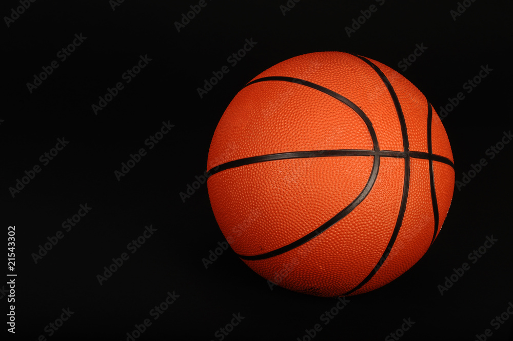 Basketball on black background ready for your type.
