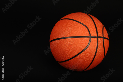Basketball on black background ready for your type.