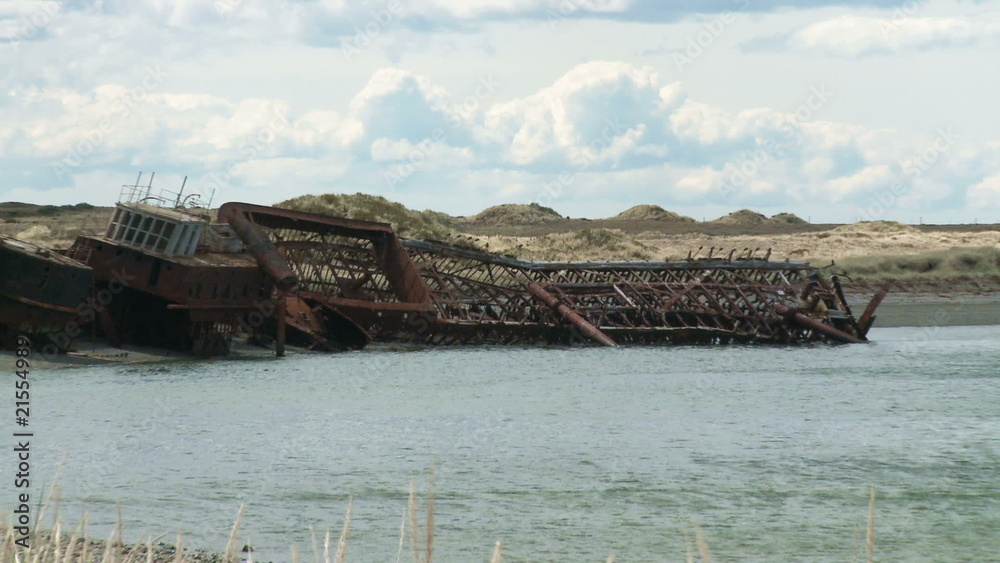 Two old abandoned ships beached on the shore Two old abandoned ships beached on the shore