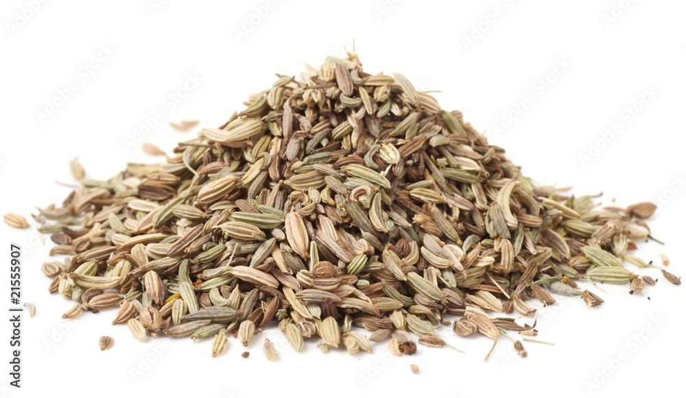 Heap of fennel seeds, macro shot, isolated