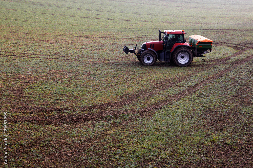 Obraz premium tractor with manure distributor