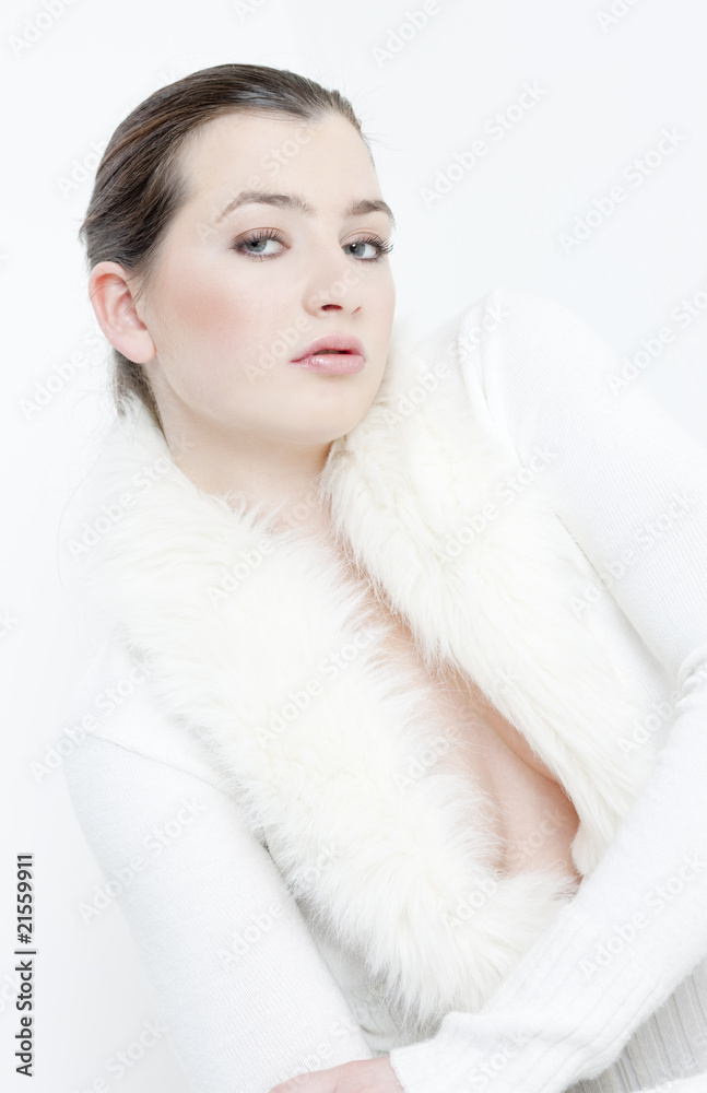 portrait of young woman wearing white sweater