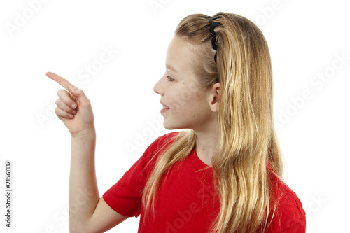 girl is pointing over white background