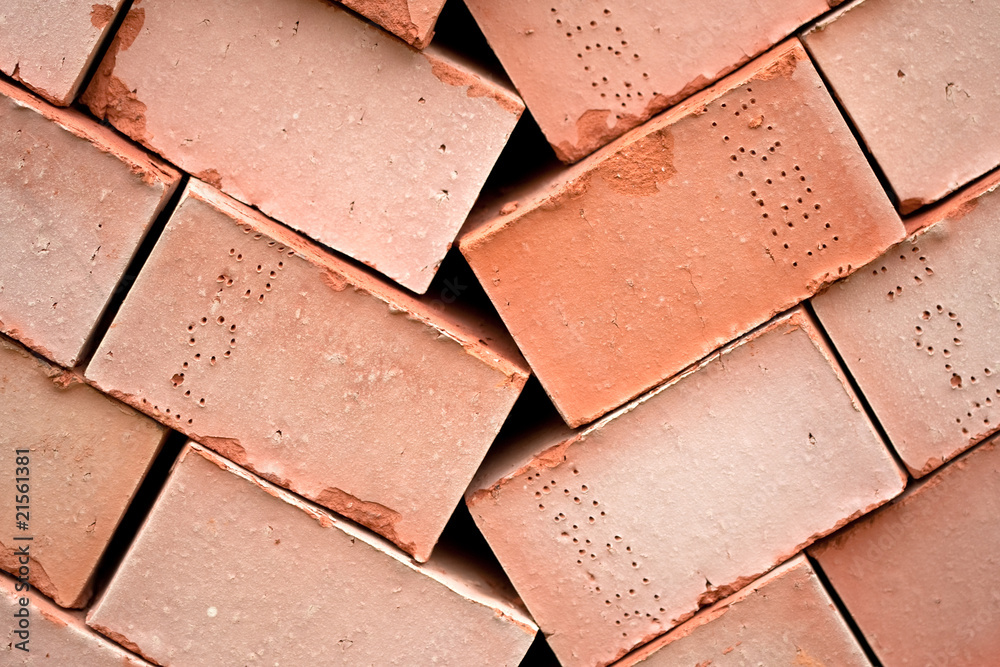 Background of many red bricks for cinstruction in pallet Background of many red bricks for cinstruction in pallet