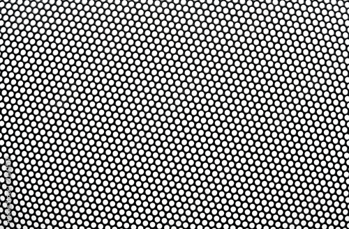 Black metal lattice with round apertures on white background. Cl