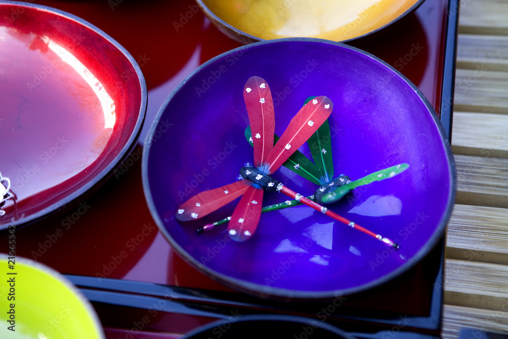 blue and red plates with art dragonfly at flea market blue and red plates with art dragonfly at flea market