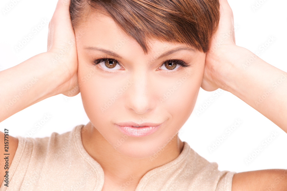 unhappy woman with hands on ears unhappy woman with hands on ears