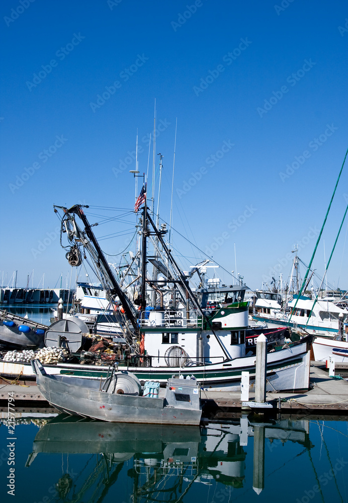 Silver Boat by Fishing Trawler