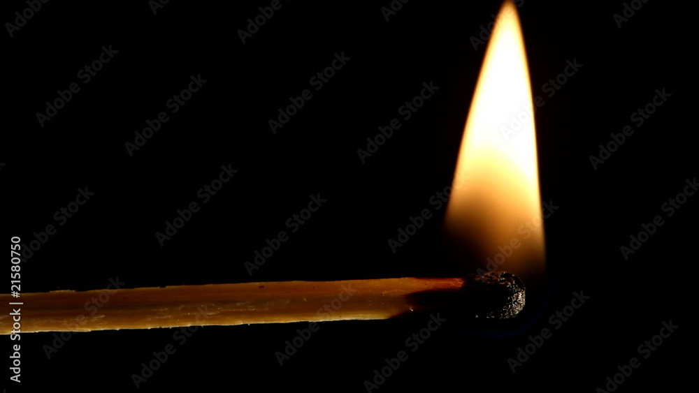 match stick burning and bending on black background