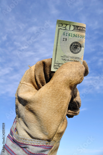 Worker Holding a Twenty Dollar Bill