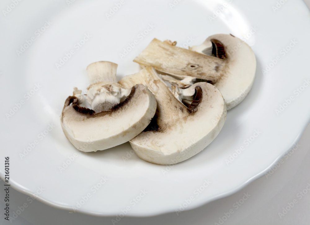 Mushrooms champignon on plate ( Agaricus ) Mushrooms champignon on plate ( Agaricus )