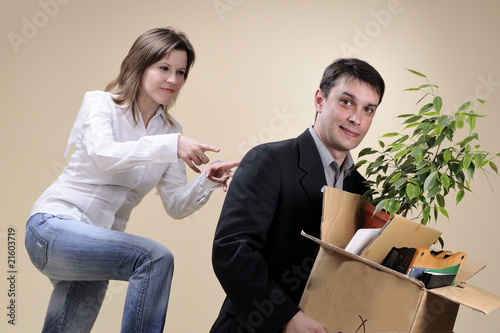 satisfied woman pushing her fired boss photo