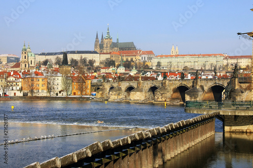 The snowy colorful Prague gothic Castle with the Charles Bridge © Kajano
