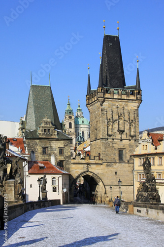 Snowy Prague St. Nicholas' Cathedral with Bridge Tower