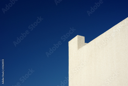 Background: yellow wall and clear blue sky