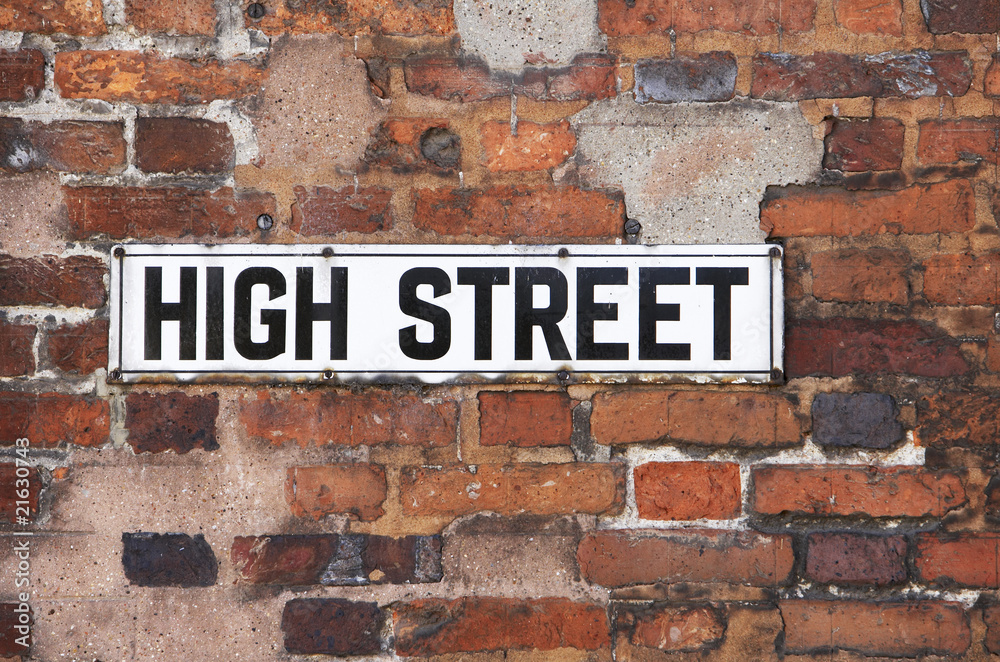 Rusty Metal High Street Road Sign On Brick Wall Rusty Metal High Street Road Sign On Brick Wall