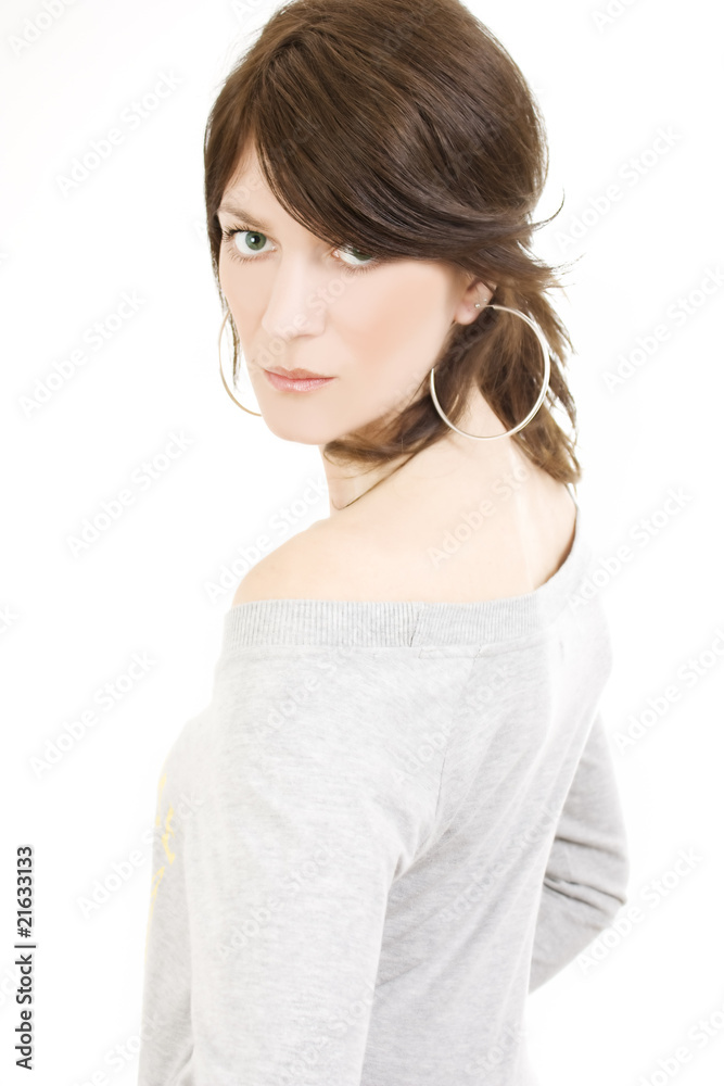 Beautiful woman looking over shoulder, studio shot Beautiful woman looking over shoulder, studio shot