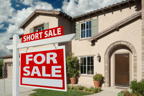 Short Sale Real Estate Sign and House photo