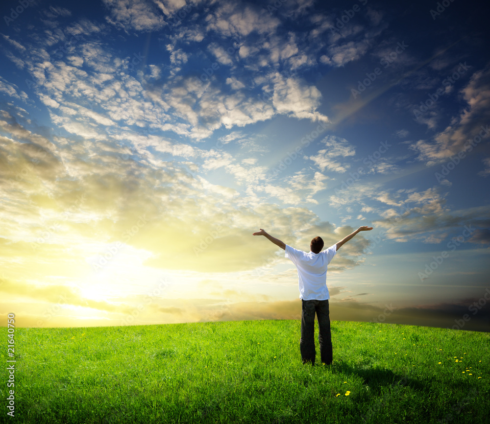 field of grass and happy young man
