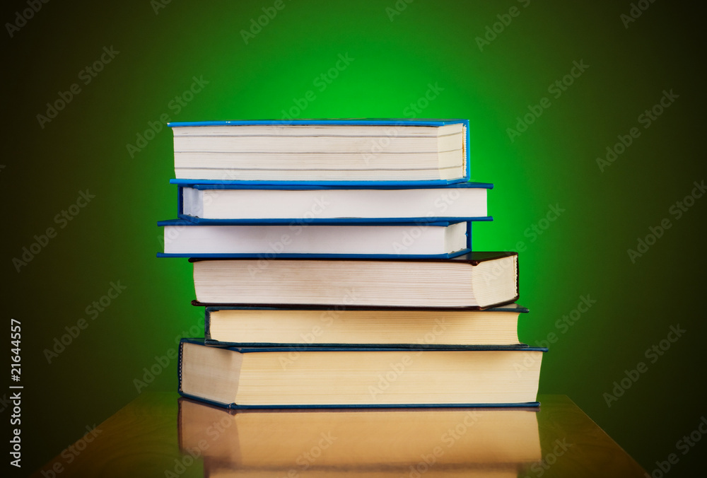 Stack of books against gradient background Stack of books against gradient background