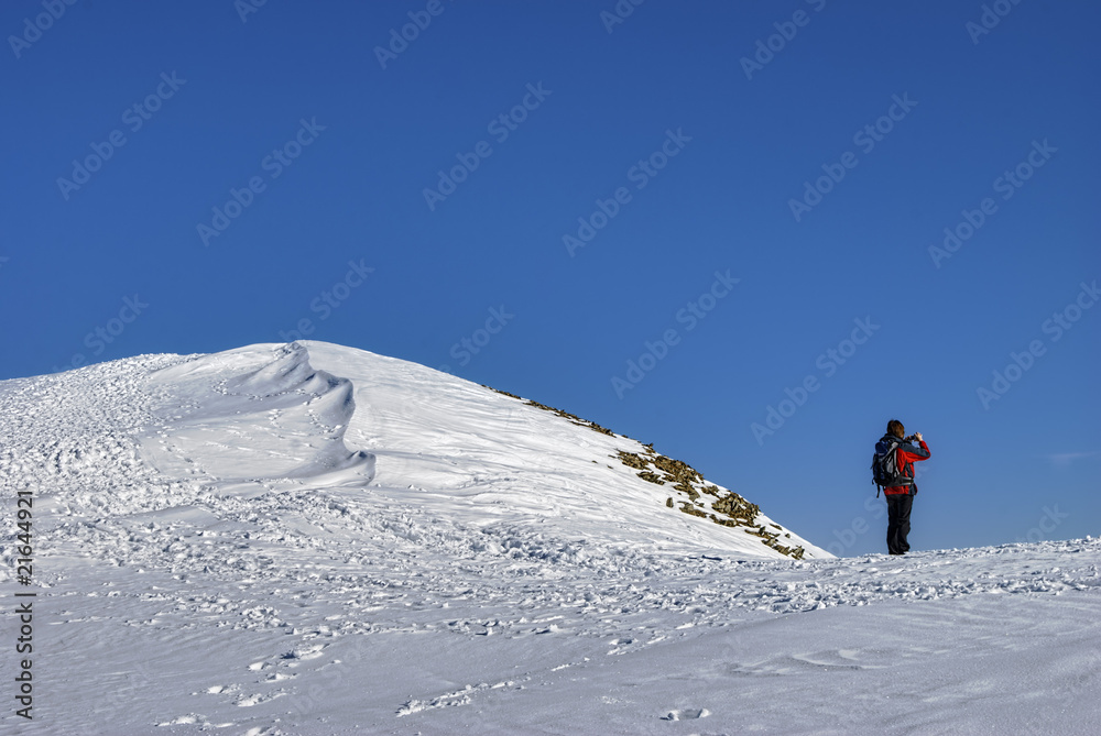 Climber on snowy mountain