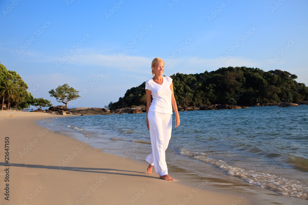 woman taking a walk on the beach