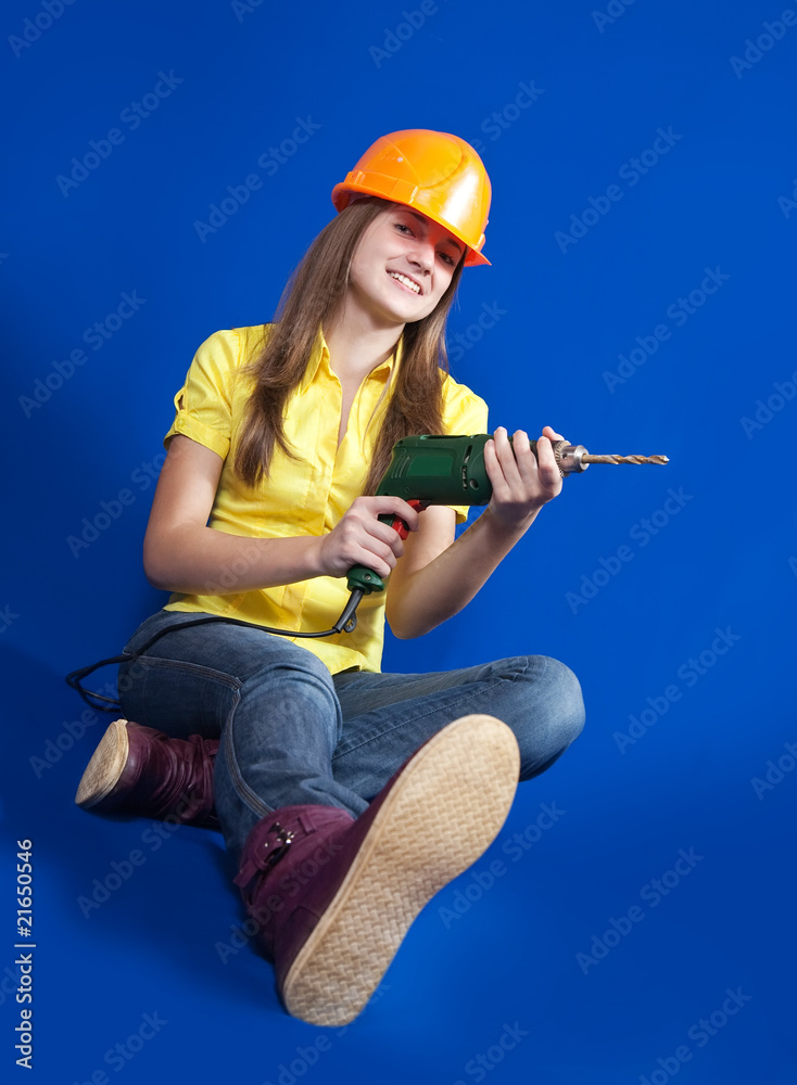 Naklejka premium Girl with drill