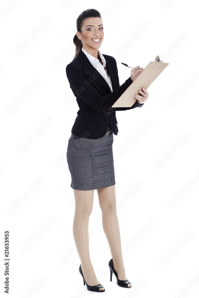 Full length of business woman writing in pad Full length of business woman writing in pad