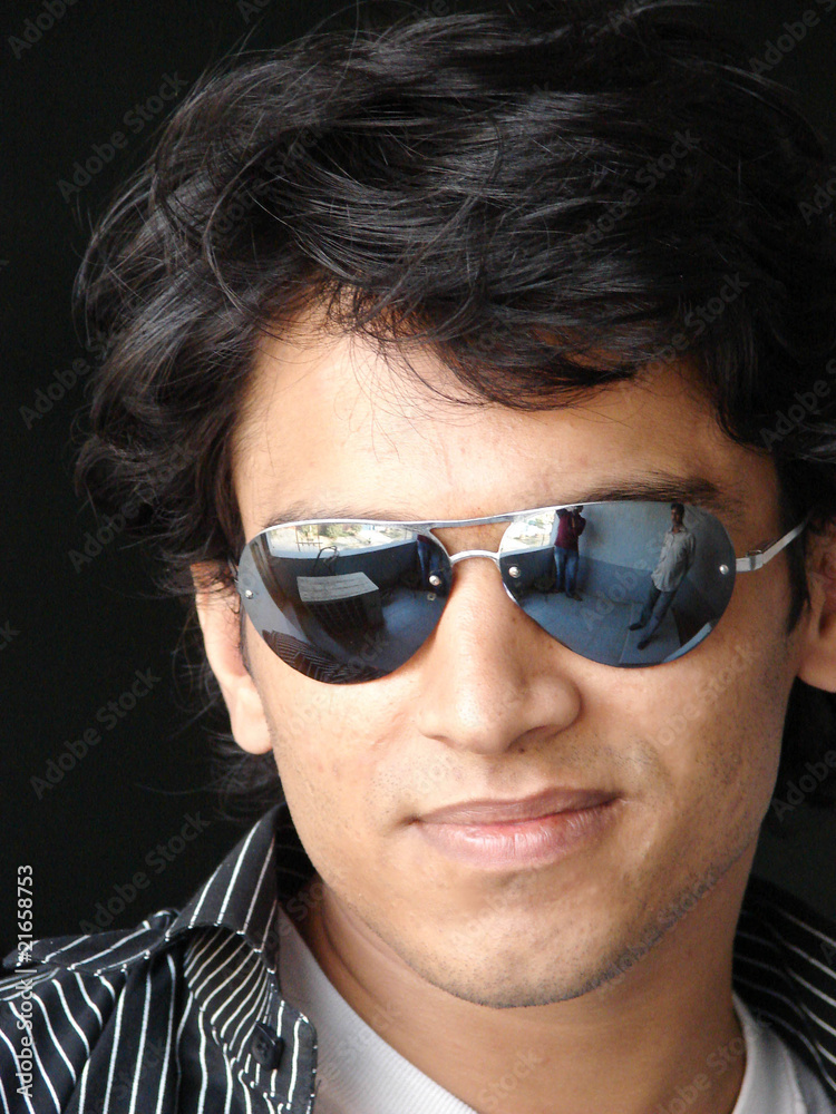 portrait of a young indian man wearing glasses portrait of a young indian man wearing glasses