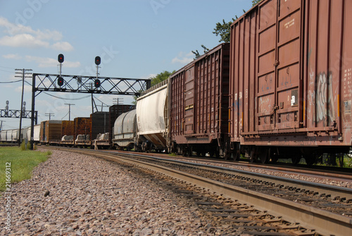 фотографія box cars and tanker on tracks