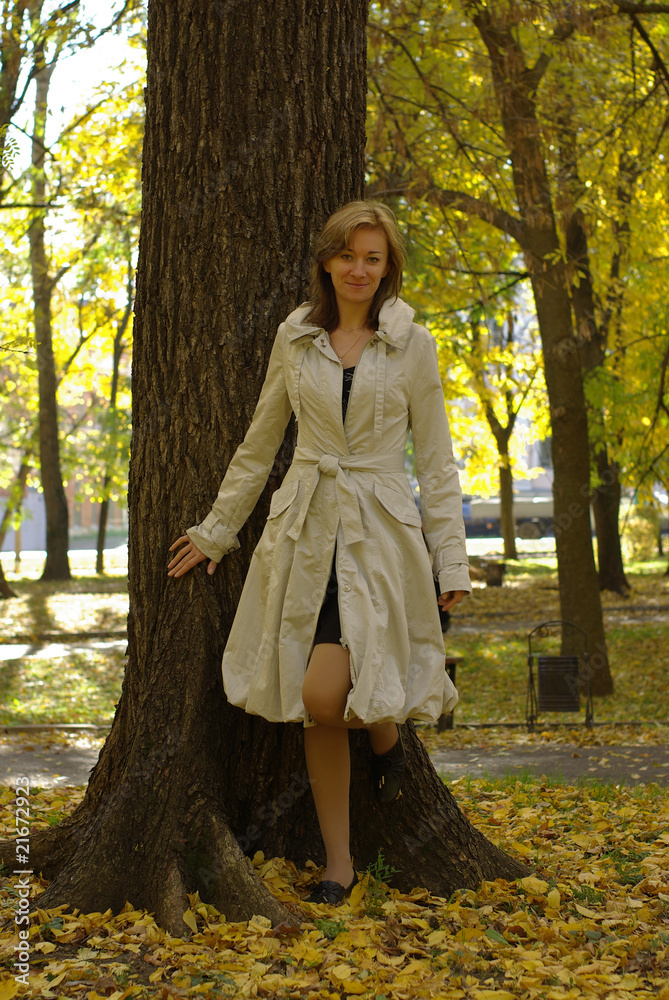 female and tree in an autumn park female and tree in an autumn park