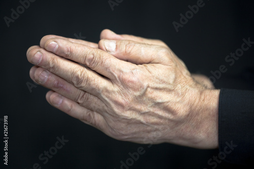 Old hands praying