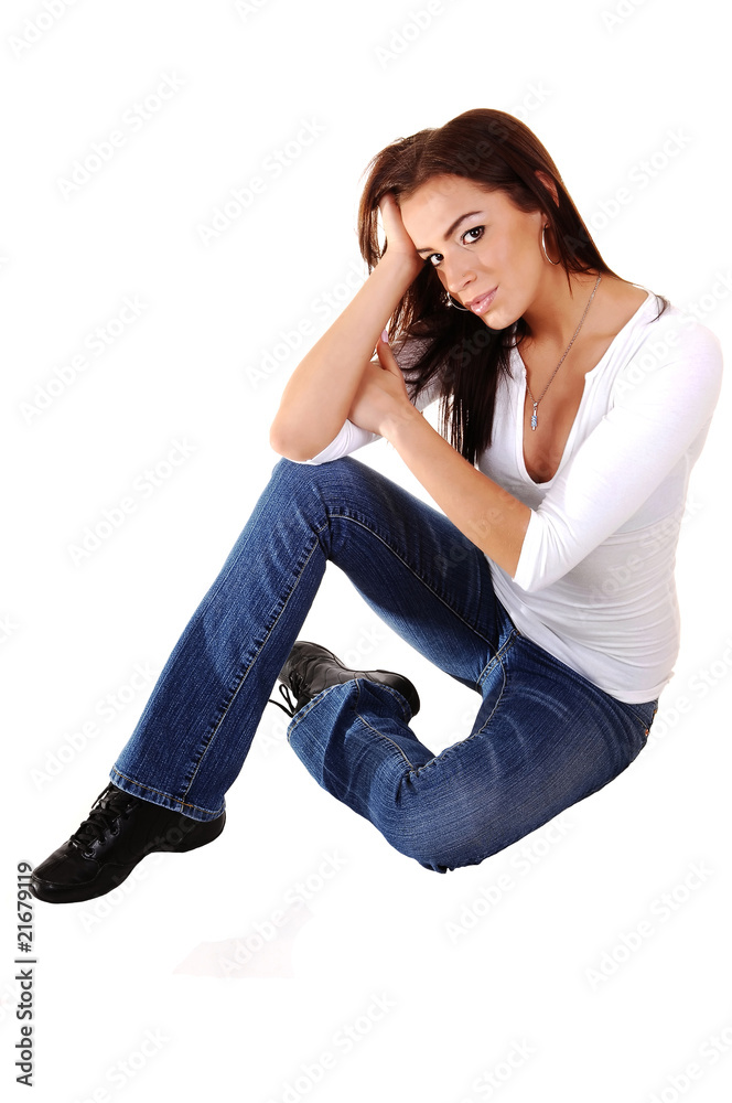 Sad girl sitting on floor.