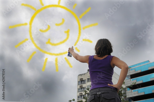 Cuadro en lienzo woman painting the sun onto the cloudy sky