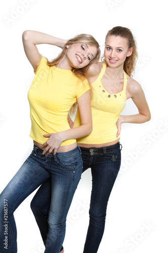 two young happy girls over white