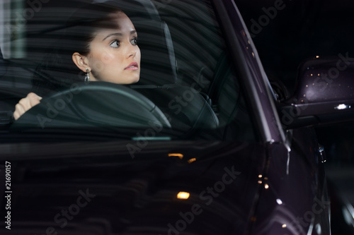 young pretty woman driving car