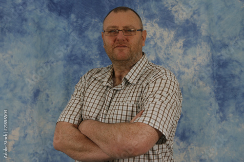 baldy beardy middle-aged man posing
