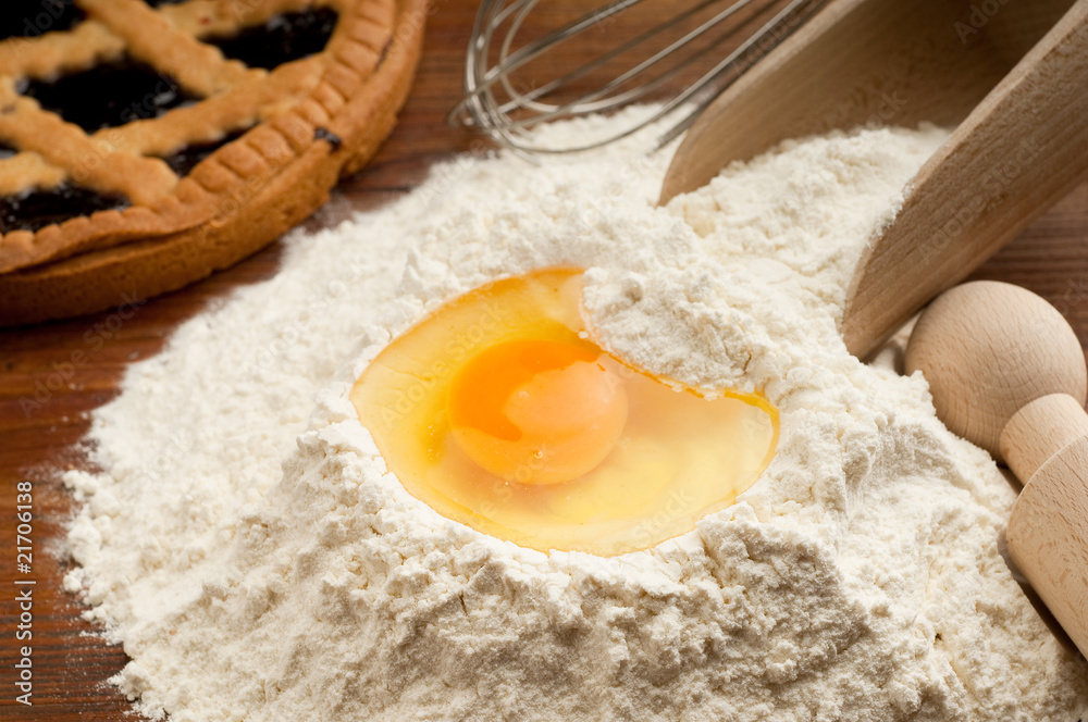flour with egg and cake on background flour with egg and cake on background