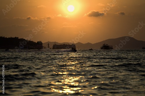 Sun go down between two islands