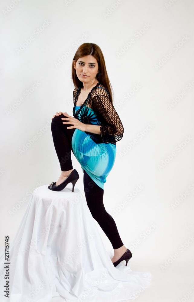 Lovely woman with her leg up on a stool Lovely woman with her leg up on a stool