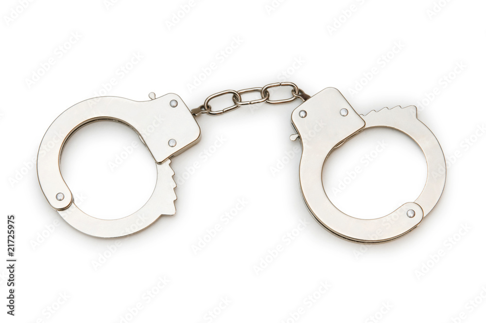 Metal handcuffs isolated on the white background Metal handcuffs isolated on the white background