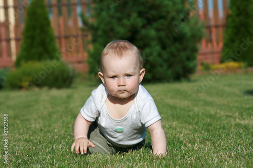 Happy baby on grass