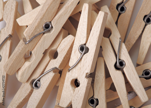 Heap of wooden clothes-peg. Top view. Abstract backround.