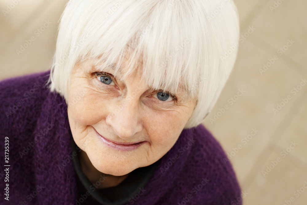 Friendly old woman looking at you and smiling Friendly old woman looking at you and smiling