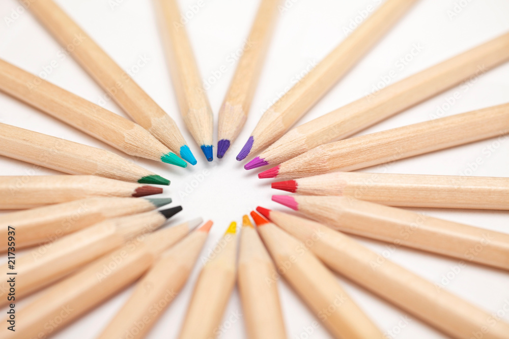 Wooden colouring pencils in a circle on white Wooden colouring pencils in a circle on white